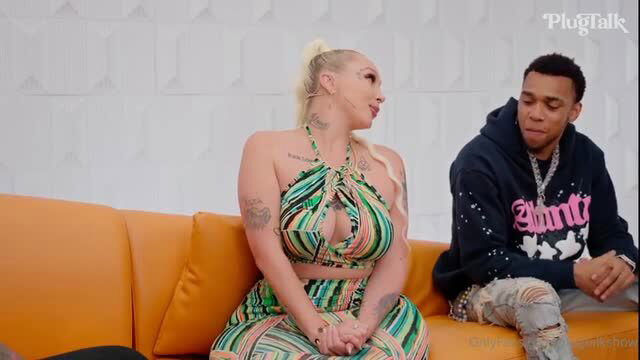 Alexis Andrews in skimpy green cutout dress on Plugtalk with rapper