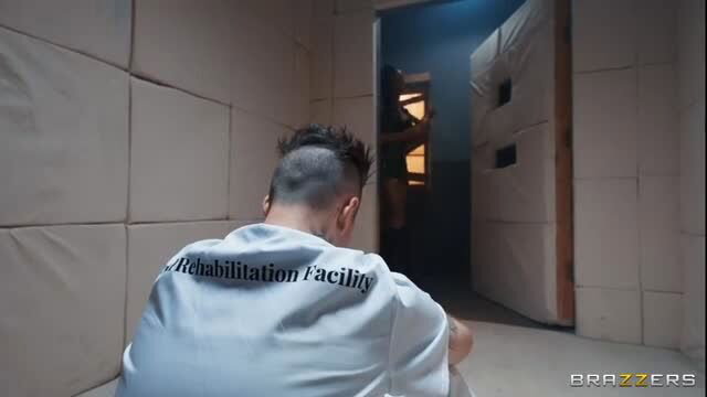 Man in white shirt sits in cell at Rehabilitation Facility, Brazzers Nurse Noir's Touch