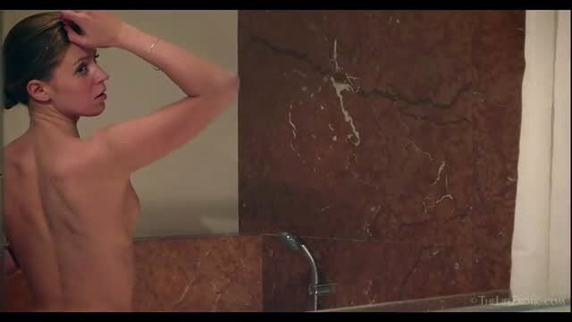 Kalisy nude in luxurious shower, bare back and bun hairstyle