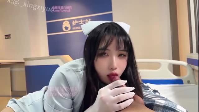 Asian nurse in uniform licks cock in hospital bed closeup