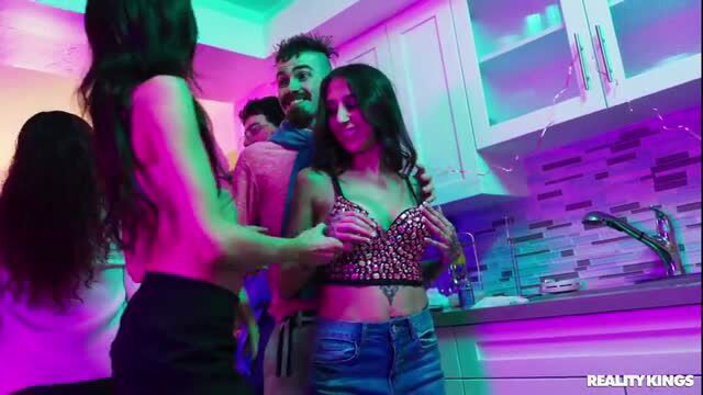 Nikki Nicole in neon-lit kitchen orgy with topless brunettes groping