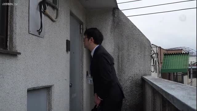 Japanese suited man peeking suspiciously at door in JAV thumbnail