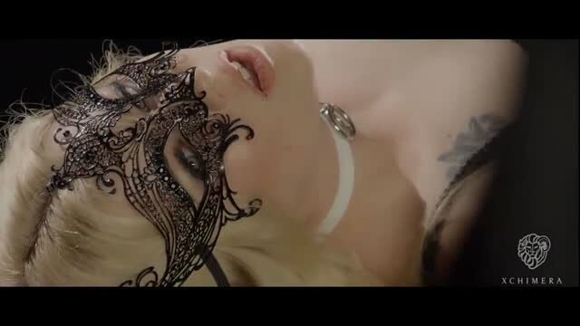 Misha Cross in lace mask and collar closeup