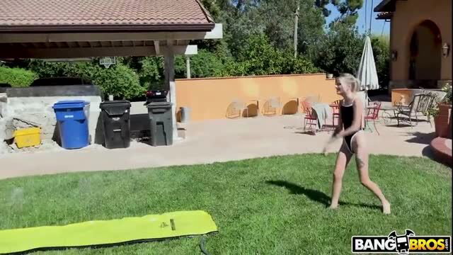 Kate Bloom in tiny black bikini on yellow slip n slide wet outdoor fun