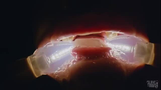 Katie Monroe's wide-open mouth with glowing cum dildos in filthy closeup