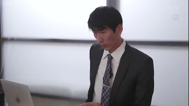 Handsome suited Asian man in office, smoking, from JAV