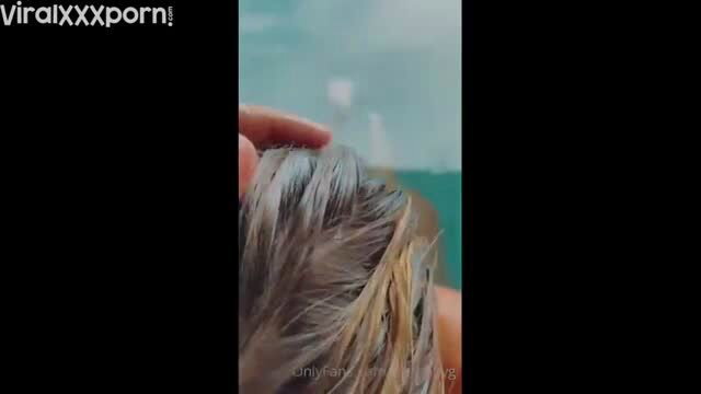 Stefanie Knight wet blonde hair by pool, hand on head tease