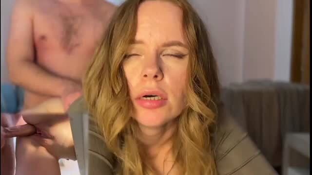 Close-up of blonde wife's ecstatic face as man gropes her during sex