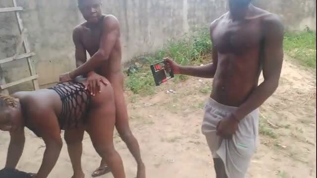 Ebony BBW in fishnet on all fours groped by two nude black men outdoors