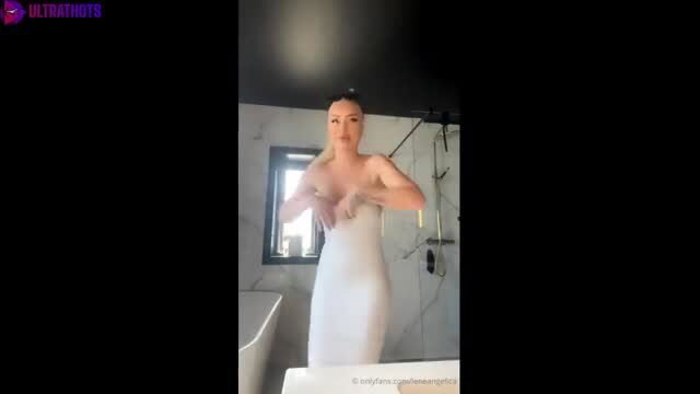 Melina Johnsen topless in tight white dress in bathroom