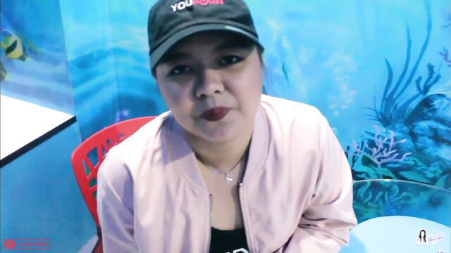 Sharinami in pink jacket and cap, sexy gym buddy closeup