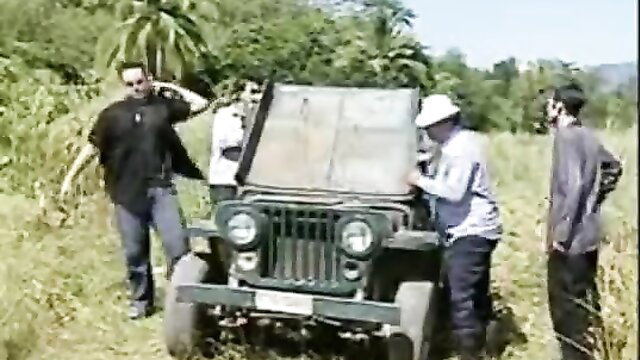 Men around vintage Jeep in Thai movie thumbnail, casual outdoor scene