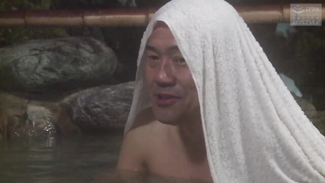Asian man wrapped in towel at hot spring onsen bath, JAV mature style