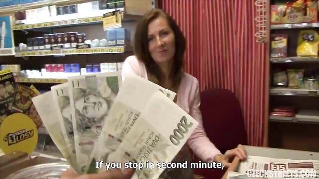 Czech Streets 77: Cute redhead amateur babe shows cash stack in store