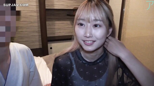 POV closeup of smiling Japanese college girl with bangs in sheer top