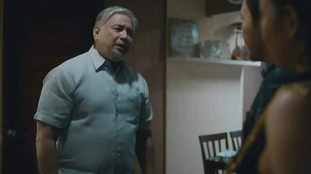 Mature Asian man in shirt confronts young Asian woman in dress, cheating tension