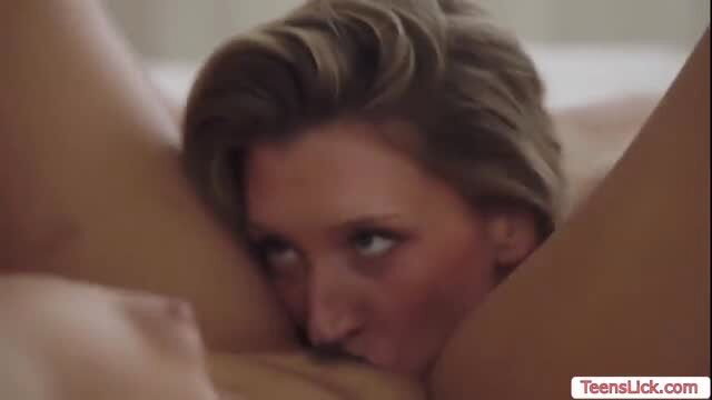 Blonde stepsister passionately kissing and undressing in bed