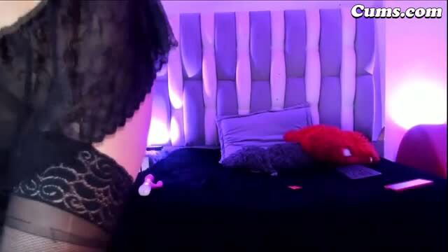 Curvy redhead in sexy lingerie teases on bed with big toy