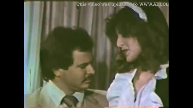 Vintage brunette in nurse outfit kissed by suited man in Candy Girls 156