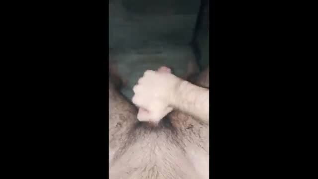 Hairy man fists wet pussy in bath tub closeup