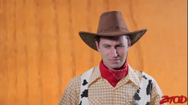 Cowboy stud in Woody costume, serious gaze, adult toy fun thumbnail