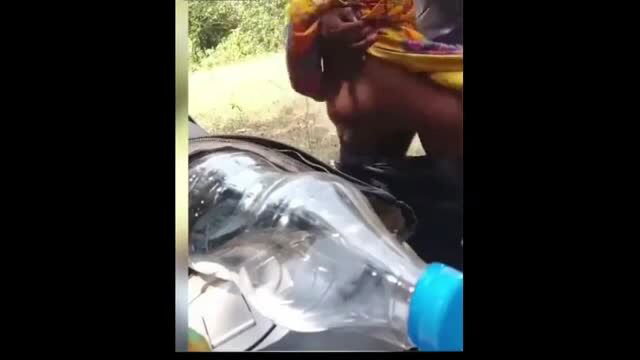 Desi woman in yellow saree squatting over bottle in outdoor amateur sex