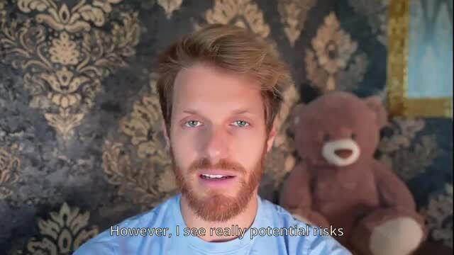 Handsome bearded man discusses risks in luxurious bedroom with teddy bear