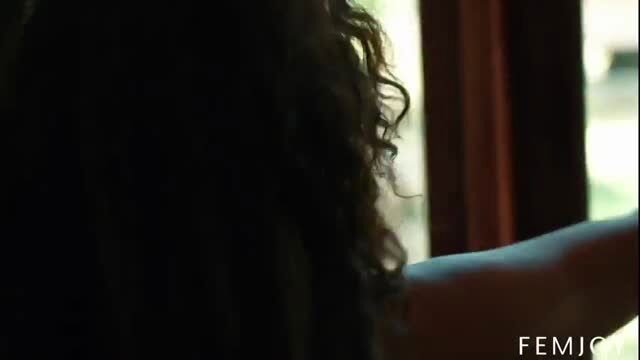 Curly-haired Asian babe teases naked body close-up by window