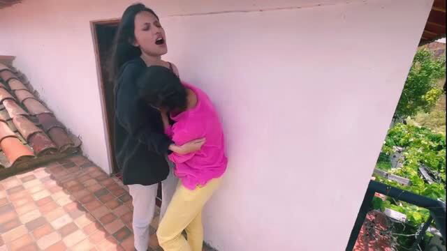 Two horny Asian babes in lesbian scissoring embrace on rooftop