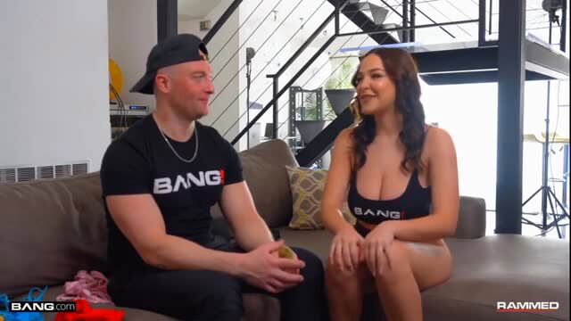 Zac Wild and busty Rissa May on couch in Bang tees, backstage tease