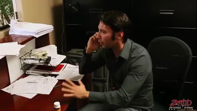 Handsome man in office shirt on phone call, gesturing passionately
