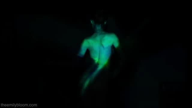 Hot babe poses naked under colorful lights showing perfect body