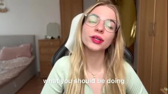 Blonde glasses girl in green top smirks teasingly in We Know You're Gay thumbnail