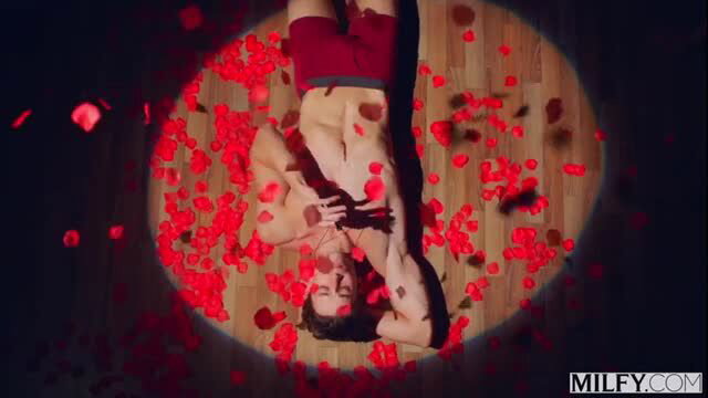 Alberto Blanco upside down surrounded by red rose petals in sexy MILFY scene