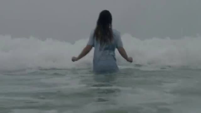 Molly Windsor wet see-thru shirt in stormy ocean nude scene