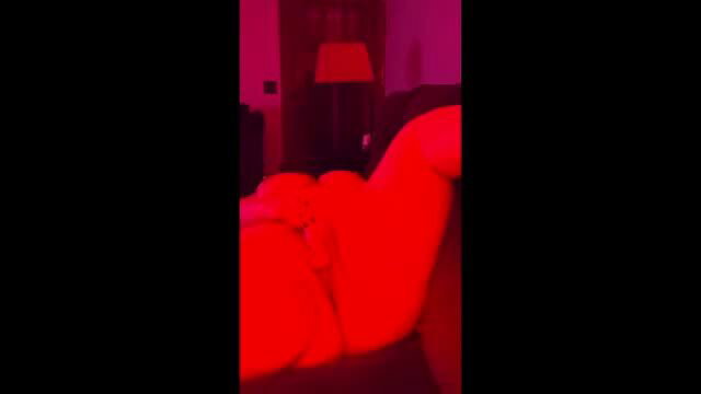 Amateur solo babe plays with big boobs on couch, red lighting climax