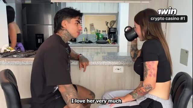 Ally Brexxx and tattooed guy chatting intimately in kitchen, Ally loves her