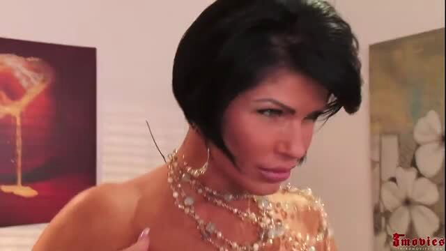 Hot brunette babe with big tits in sexy necklace closeup