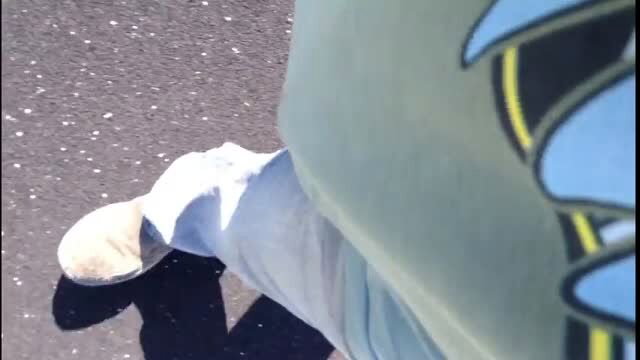 Woman pissing on public walking trail in white pants down, teal shirt