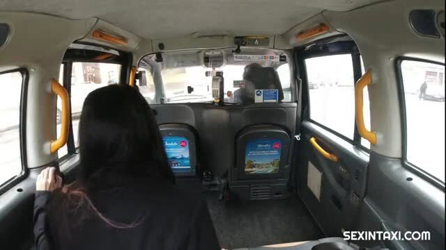 Tattooed Czech teen in black top seen from behind in yellow taxi