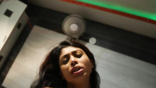 Indian beauty with expressive eyes and parted lips in steamy closeup