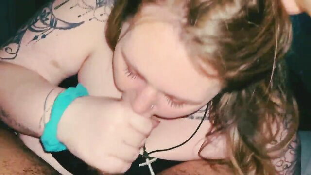 Tattooed wife deepthroating husband's cock closeup