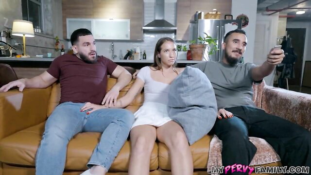 Violet Reign squeezed between two men on couch in hot stepsis tease