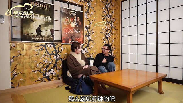 Big tits Chinese couple in JAV interview, busty woman in brown coat