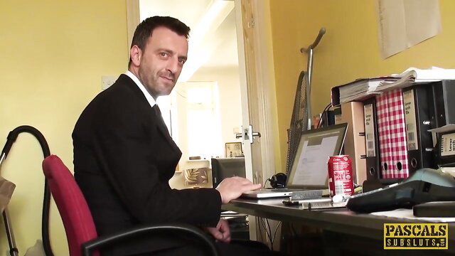 Man in suit at desk in Kimmie Foxx anal scene thumbnail