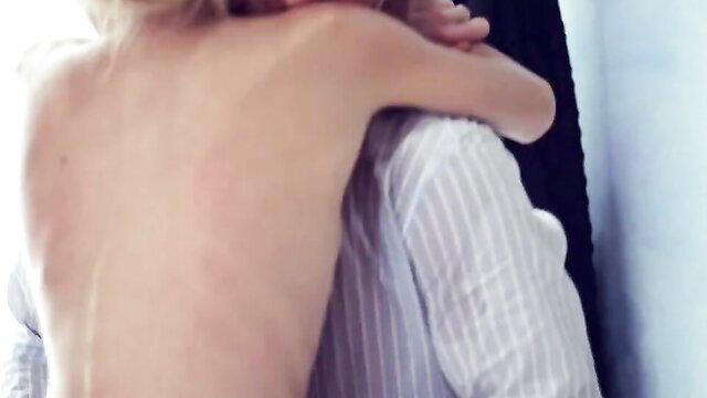 Odette Delacroix nude back hugged by man in shirt