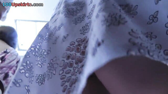 Amateur upskirt of girl in lacy white A-line dress showing panties