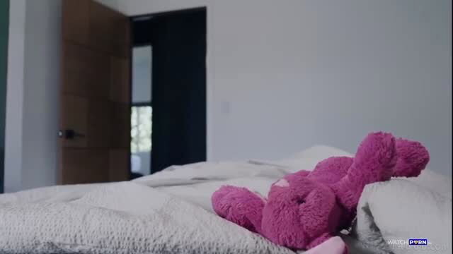 Nicole Nichols pink teddy bear on bed in Pure Taboo scene