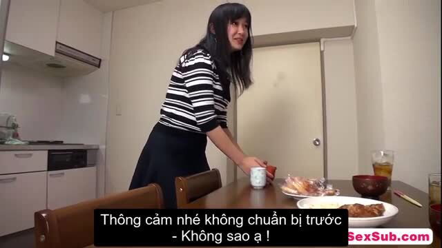 Asian babe in striped top and skirt serves food in kitchen, JAV style