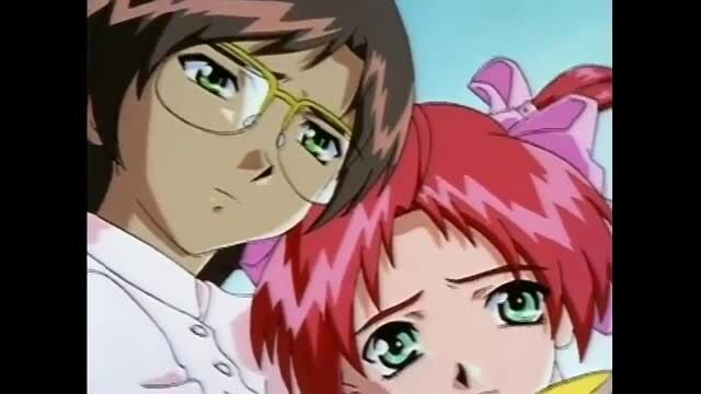 Anime hentai couple close-up: glasses guy and redhead girl gazing intimately
